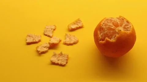 A mandarin orange in stop motion Stock Footage 142892907