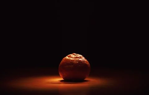 Mandarin on Orange Surface Stock Photos