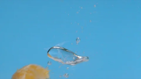 Mandarin Oranges Dropping into Water Slow Motion Macro Video stock 126731002