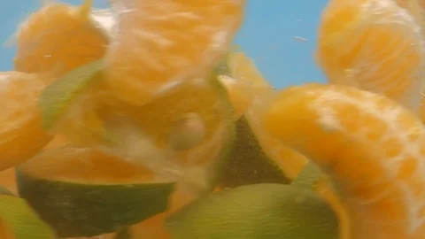 Mandarin Oranges Rotating in Water Slow Motion Macro Video stock 126731069
