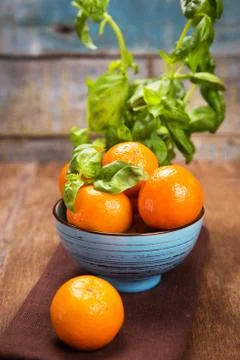 Mandarine with basil Stock Photos