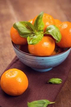 Mandarine with basil Stock Photos