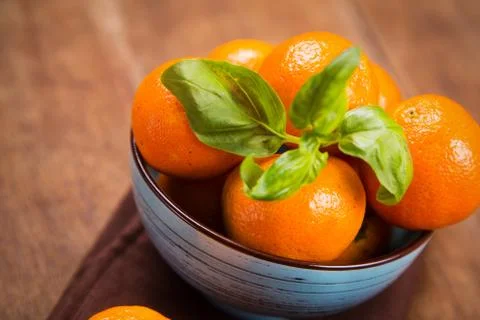 Mandarine with basil Stock Photos