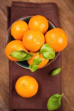 Mandarine with basil Stock Photos