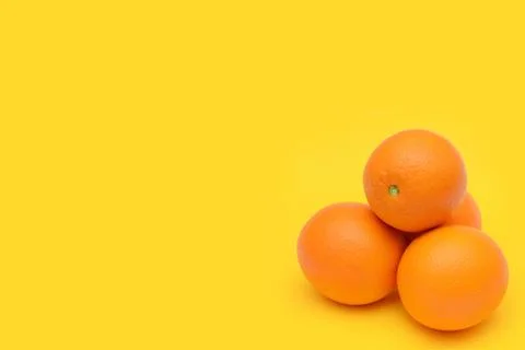 Mandarines on a yellow background Stock Photos