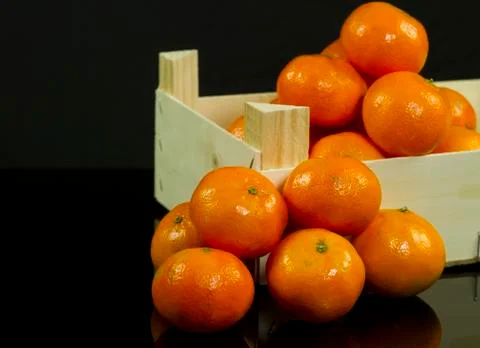 Mandarins in crate Stock Photos