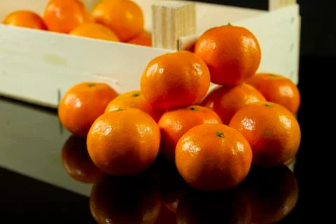 Mandarins in crate Stock Photos