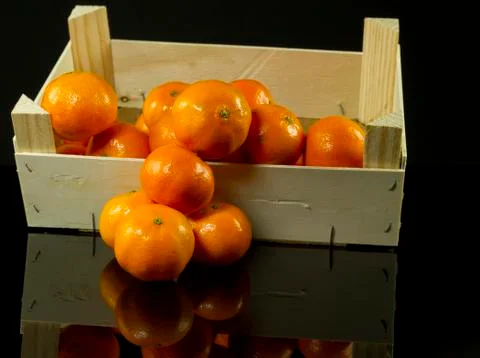 Mandarins in crate Stock Photos