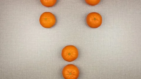 Mandarins moving on a textured gray background. Видео 150466150