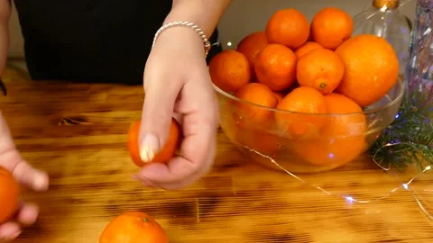 Mandarins on the table Stock Footage 231159480