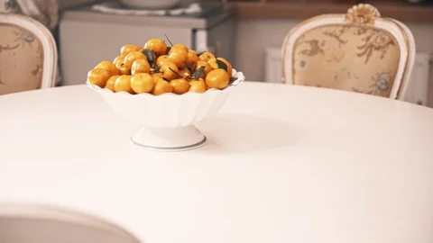 Mandarins on a white table in the classic kitchen Video stock 99659973