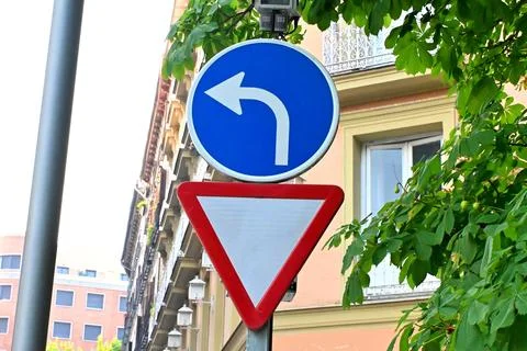 Mandatory Left Turn and Yield Sign, 22/08/2026 Stock Photos