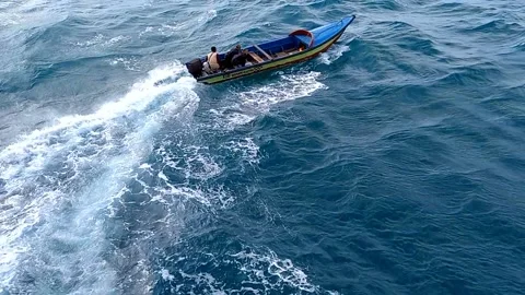 Maneuvering boat Stock Footage 219469366