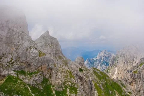 Mangart in Low Clouds Stock Photos
