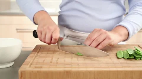 Mange tout being chopped Stock Footage 24672615
