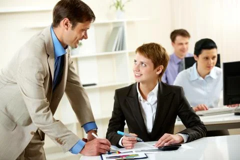 Manger consulting his young employee Stock Photos