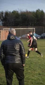 Manger looking on as Play goes on Stock Photos
