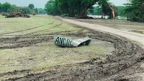 Mangled Canoe and Flood Debris, Wide Shot Guadalupe River, Kerrville Texas 2025 Stock Footage 312687081