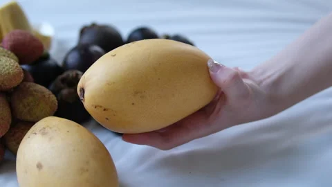Mango and lychee in smoke on a black background fruit soup Stock Footage 310040995