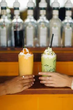 Mango and Matcha Shakes with Whipped Cream Close-Up Stock Photos