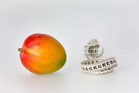 Mango and measuring tape Stock Photos