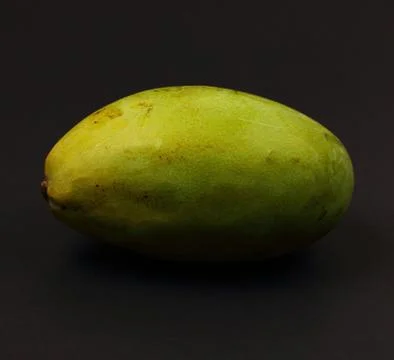 Mango on black background Stock Photos
