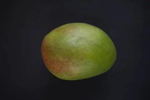 Mango on black background Stock Photos