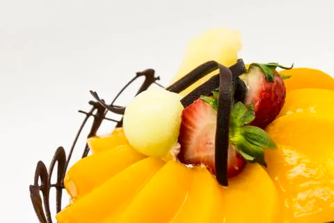 Mango cake with chocolate and fruit Stock Photos