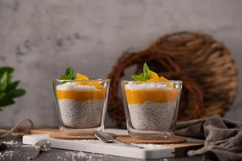 Mango Chia Seed Pudding with Coconut and Mint in Glass Cups Stock Photos