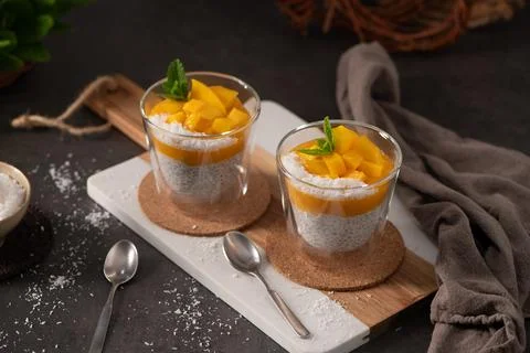 Mango Chia Seed Pudding with Coconut and Fresh Mint in Glass Cups Stock Photos
