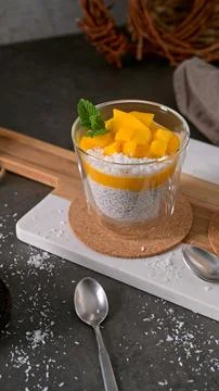 Mango Chia Seed Pudding with Coconut and Fresh Mint in Glass Stock Photos