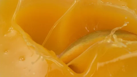 Mango chunks falling into mango juice in... | Stock Video | Pond5