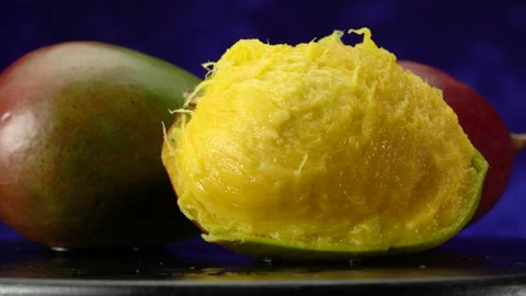 Mango close-up, on a dark background. Video stock 154888143