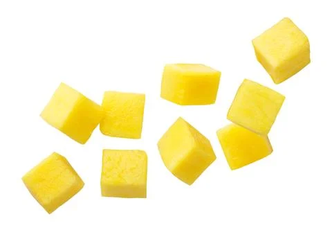 Mango cubes flying close-up on a white. Isolated Stock Photos