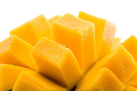 Mango cubes / slices close up isolated on white / macro Stock Photos