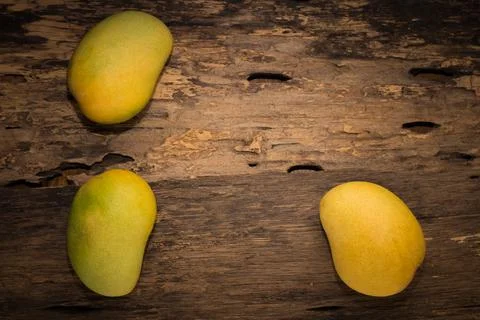 Mango on a dark wood background Foto stock