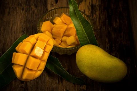 Mango on a dark wood background Foto stock