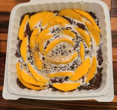 Mango Dessert with Cream in Takeout Container Stock Photos