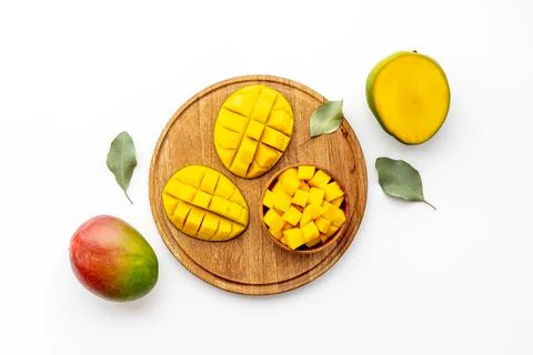 Mango fruit and mango cubes in bowl. Fruits background Stock Photos
