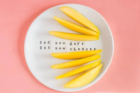 Mango fruit and mango slices on the white plate. Stock Photos