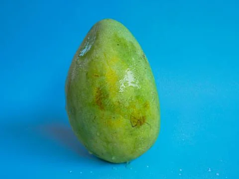 Mango fruit with blue background Stock Photos