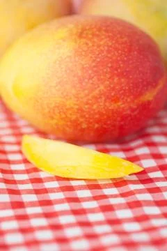 Mango fruit on checkered fabric Stock Photos
