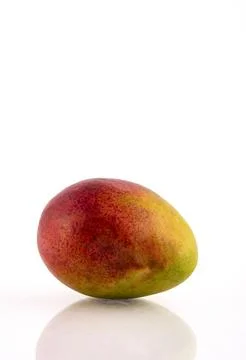 Mango fruit isolated on white background with reflection and clipping path. Stock Photos