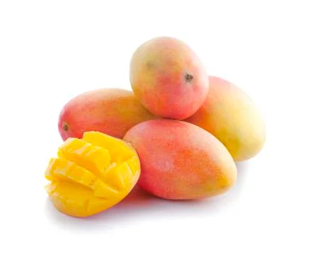 Mango fruit with mango cubes and slices - Stock Photos
