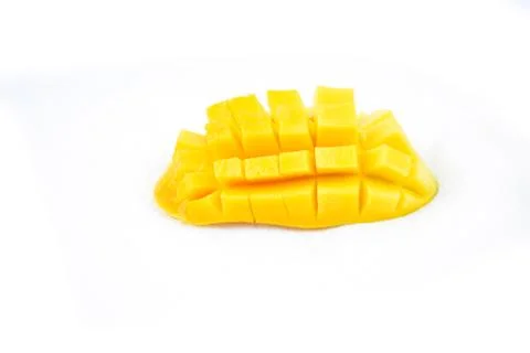 Mango fruit with mango cubes and slices. Isolated on a white background Stock Photos