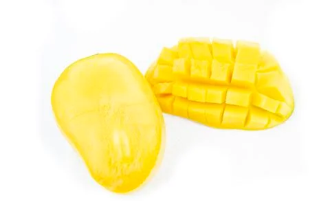 Mango fruit with mango cubes and slices. Isolated on a white background Stock Photos