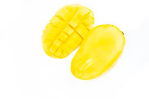 Mango fruit with mango cubes and slices. Isolated on a white background Foto stock