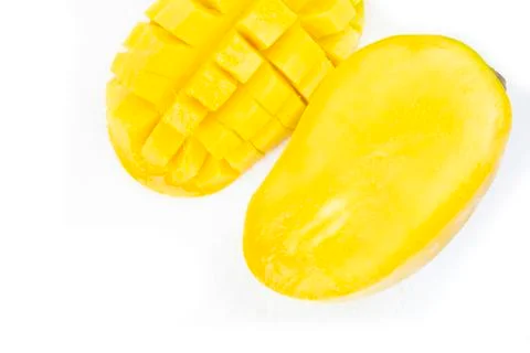 Mango fruit with mango cubes and slices. Isolated on a white background Stock Photos