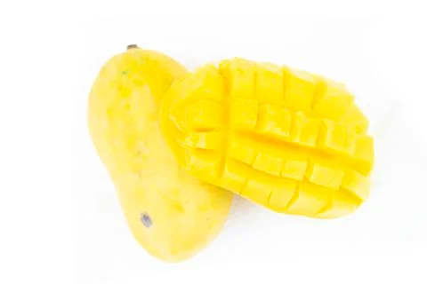 Mango fruit with mango cubes and slices. Isolated on a white background Stock Photos