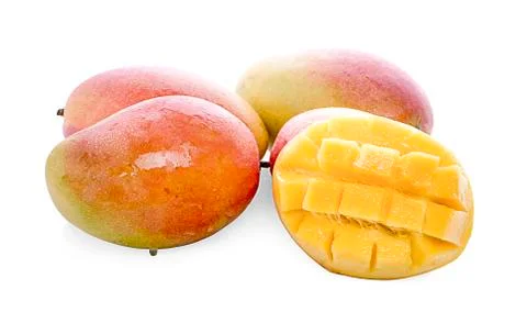 Mango fruit with mango cubes and slices. Stock Photos